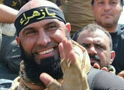 Pictures Purport to Show Iraqi Shia Militant Abu Azrael Slicing Burnt ISIS fighter