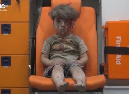 Harrowing video shows dazed, bloodied boy pulled from Aleppo rubble