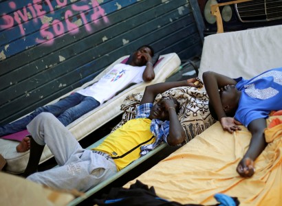 Tempers flare as temperatures soar at Rome’s ‘Gloomy Street’ migrant centre
