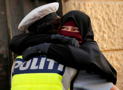 Danish police investigate officer who hugged niqab-wearing protester