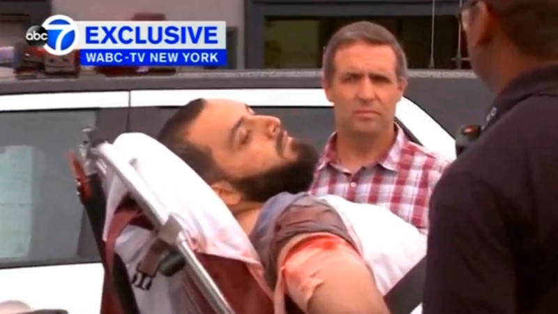 Bombing suspect Ahmad Khan Rahami being loaded into an ambulance after a shoot-out with police in Linden